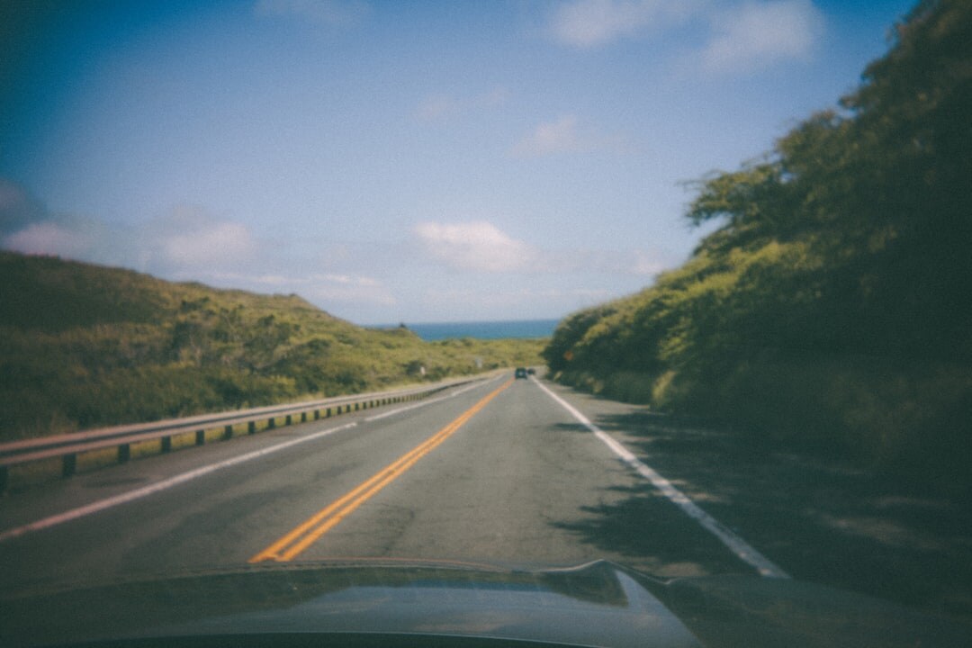 Driver perspective on highway through windshield